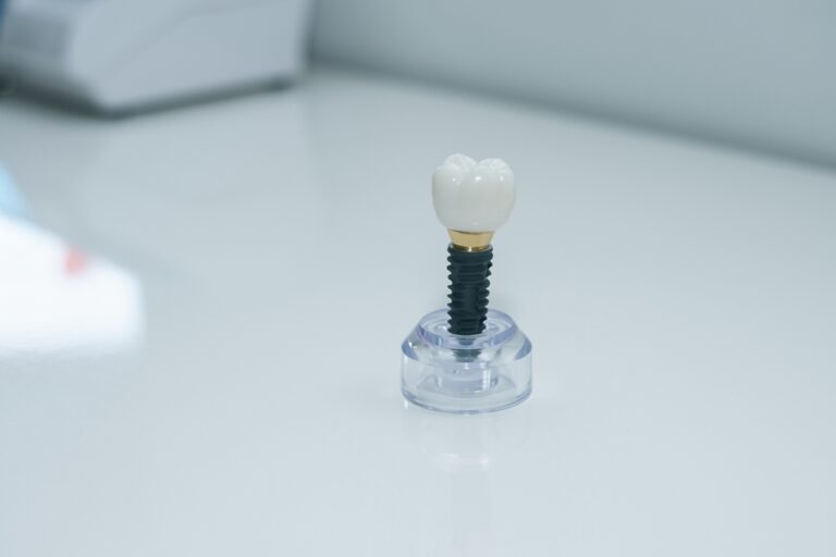 A patient consulting with a dentist about dental implants